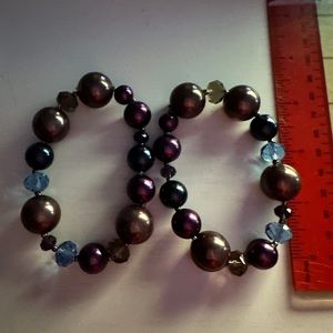 Multi-color (purple, blue, bronze, taupe) bracelets.